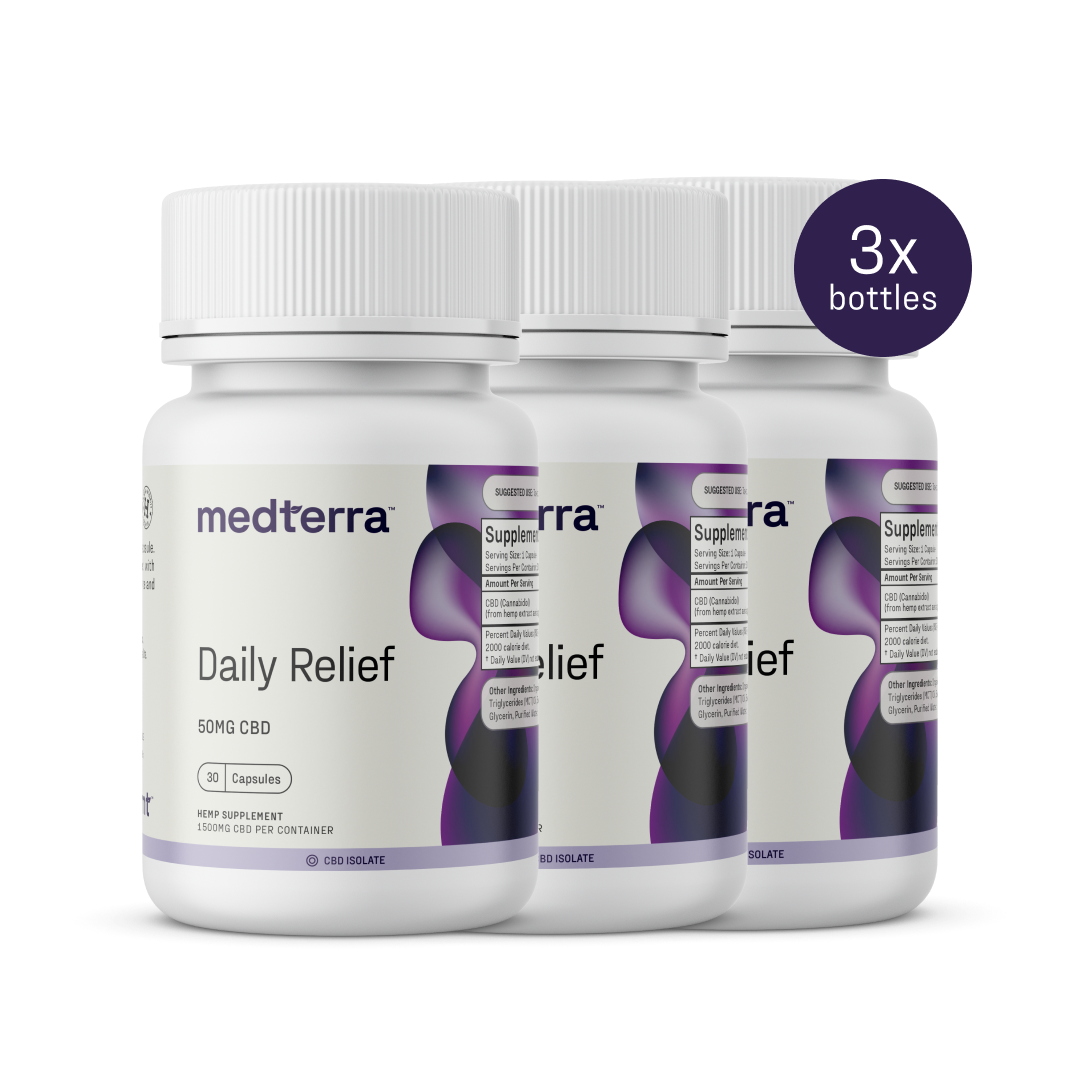 Three bottles of Medterra Daily Relief CBD Isolate Capsules, with white caps and predominantly white labels accented in purple and black, are aligned side by side for THC-free relief. A purple circle on the right indicates "3x bottles.