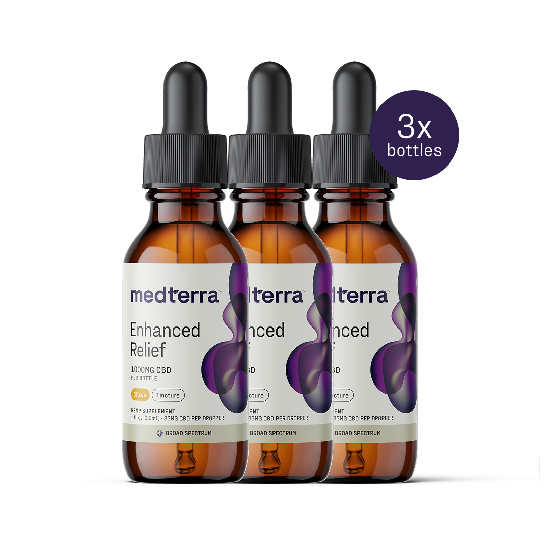 Three bottles of Medterra Enhanced Relief Broad Spectrum CBD Oil, each with 1000mg, are lined up. The white label with a purple abstract design notes "3x bottles," highlighting its role in promoting overall wellbeing.