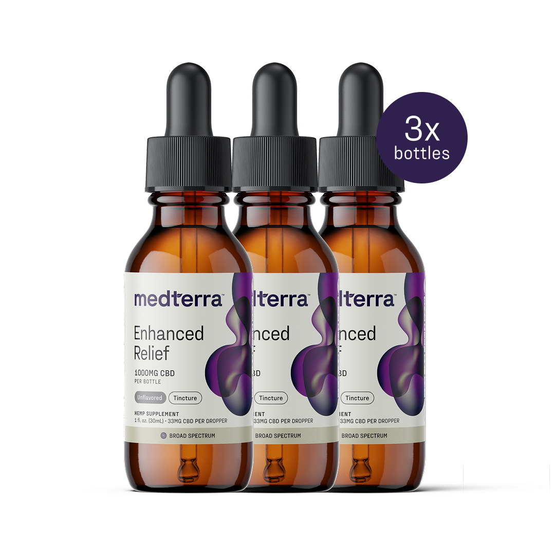 Three bottles of Medterra's Enhanced Relief Broad Spectrum CBD Oil are shown against a white background. Each amber bottle has a black dropper cap, and the purple label includes a circular "3x bottles" badge.