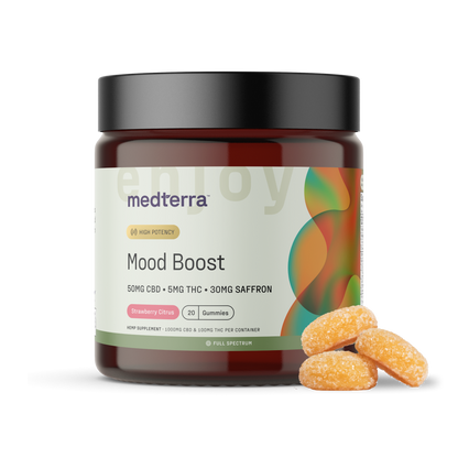 A dark amber jar of Medterra Mood Boost Gummies, labeled with "50mg CBD + 5mg THC + 30mg Saffron" in strawberry citrus flavor, contains 20 gummies. Displayed next to the jar are three sugar-coated orange gummies, illustrating the optimal blend of CBD and THC for an enjoyable mood enhancement.