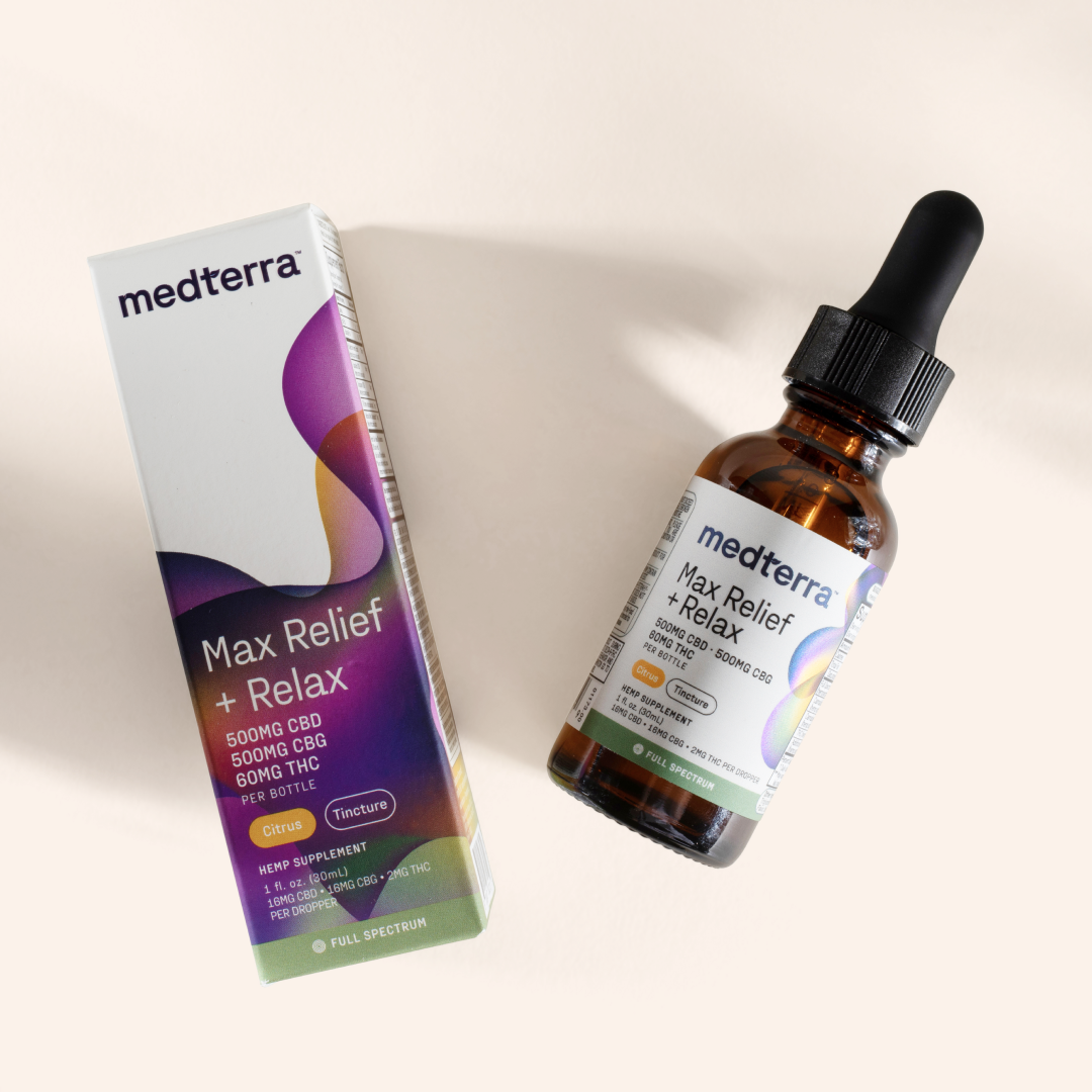 A brown glass bottle with a dropper labeled "Medterra Max Relief + Relax Full Spectrum CBD Oil" sits beside its packaging box. The label reveals it contains 500mg of CBD, 500mg of CBG, and 600mg of THC. The CBD+CBG Full Spectrum Tincture promises relaxation support through the entourage effect with a purple, white, and yellow gradient design.