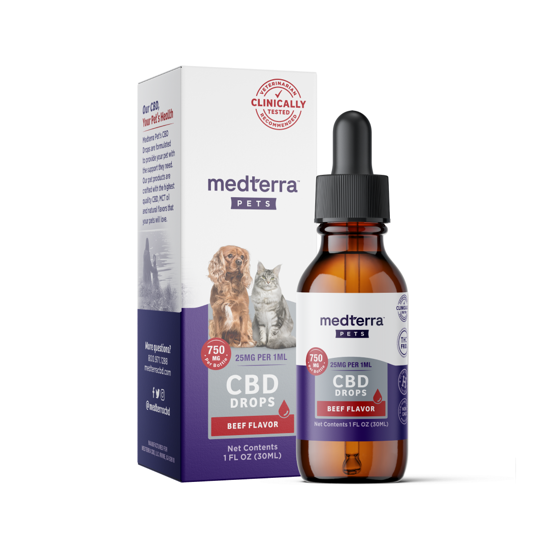A 30ml bottle of Medterra Pet CBD Drops in natural beef and chicken flavors stands next to its box. The bottle has a dropper lid and a label with the Medterra logo. The box features images of a dog and cat, highlighting that the product is clinically tested, crafted with organic ingredients, and contains 750mg CBD.