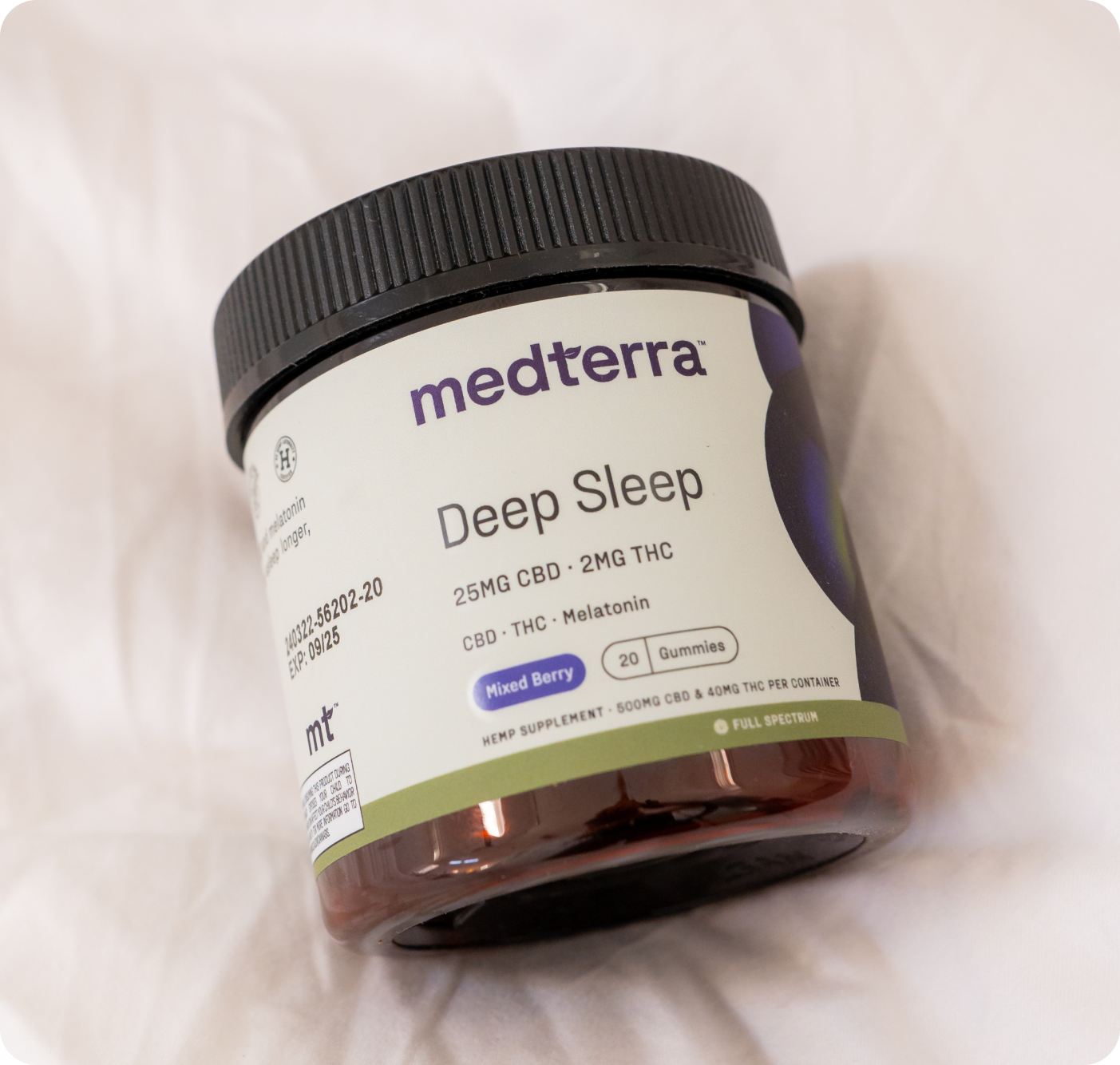Medterra's Mother's Day Bundle includes a jar of mixed berry Deep Sleep gummies, each with 25mg CBD, 2mg THC, and melatonin. The container has a black lid and contains 20 gummies.
