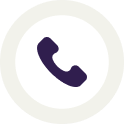 A purple phone receiver icon is centered within a white circle, bordered by a light beige ring. The icon represents a telephone call. Designed with the highest quality in mind, its overall look is simple and modern.